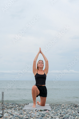 Fitness outdoor.Fitness instructor goes sports,yoga sea.Sports,care for physical and mental health,wellness,fitness the forest,nature,yoga practice.Fitness instructor,Active lifestyle,Fitness sea