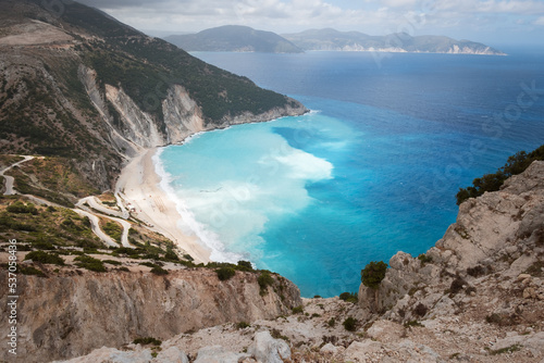Myrtos Beach - unique turquoise water landmark seashore with a bright white pebbles often proclaimed as one of the best beaches in Greece. Kefalonia island, Greece. photo