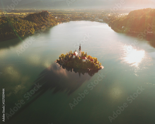 Aerial view of the church Marijinega Vnebovzetja at sunset, Lake Bled, Slovenia. photo