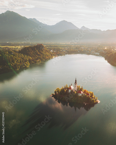 Aerial view of the church Marijinega Vnebovzetja at sunset, Lake Bled, Slovenia. photo