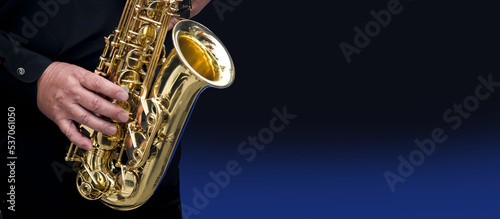 close-up of the hands of a musician playing the saxophone