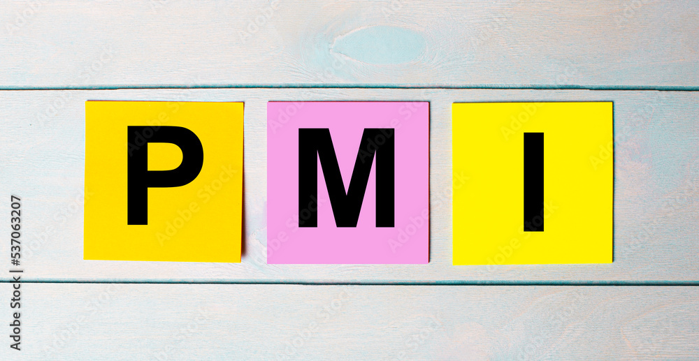 Three multi-colored paper stickers with PMI Project Management Institute text on a blue wooden background. Three multi-colored paper stickers with PMI Project Management Institute text on a blue wooden background.
