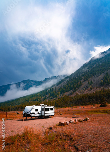 RV Camper Trailer In Autumn Fall Outdoor Mountain Landscape