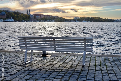 A bench in central Stockholm  an old town. The view over the sea into other capital islands