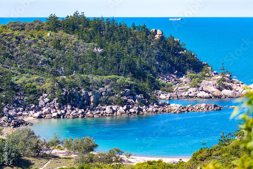 Fototapeta Naklejka Na Ścianę i Meble -  aerial view of paradise beach with turquoise water on magnetic island, small paradise bay surrounded by rocks, beach holiday in queensland, australia
