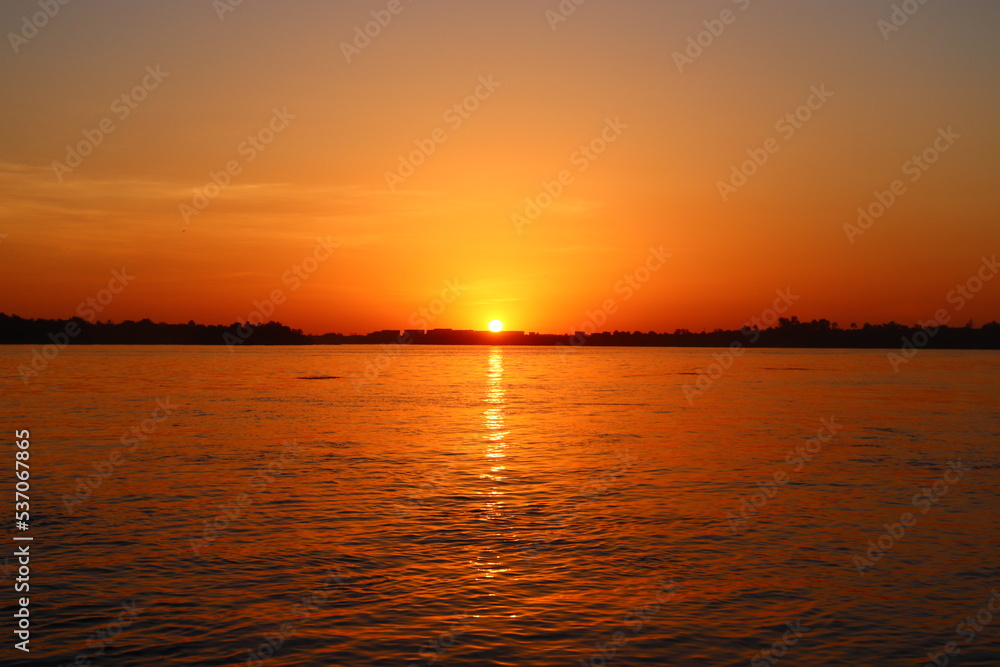 Beautiful orange sunset over the river Nile in Aswan, Egypt Beautiful orange sunset over the river Nile in Aswan, Egypt