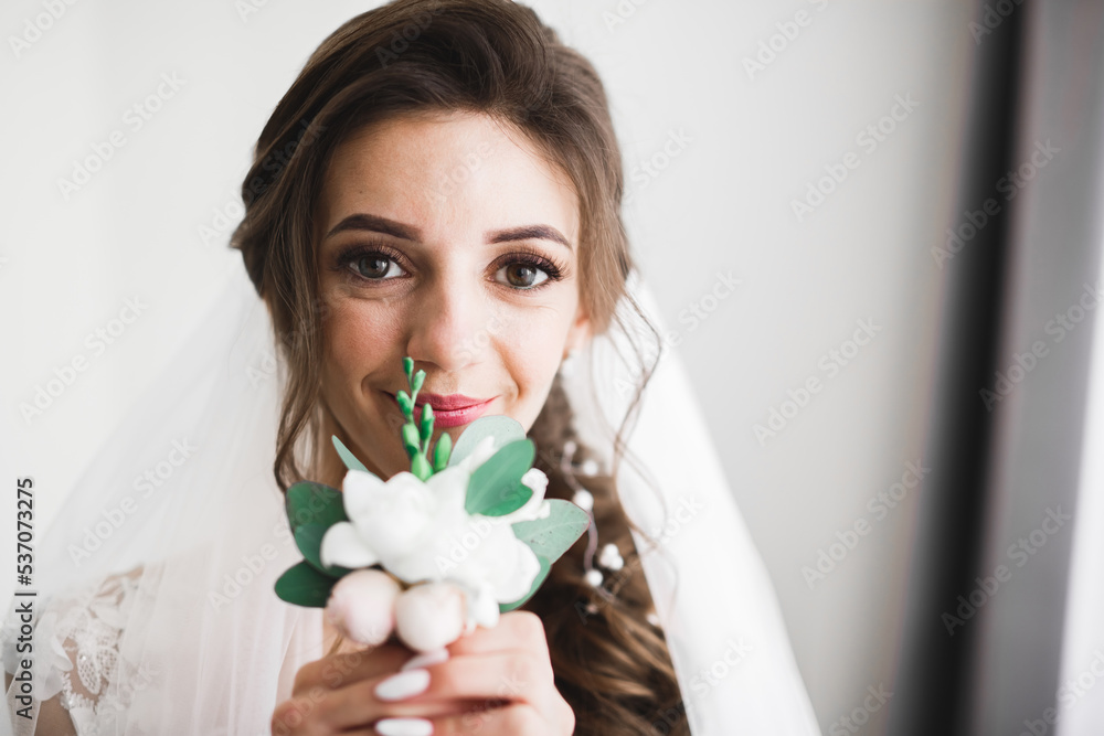 Luxury wedding bride, girl posing and smiling with bouquet Luxury wedding bride, girl posing and smiling with bouquet