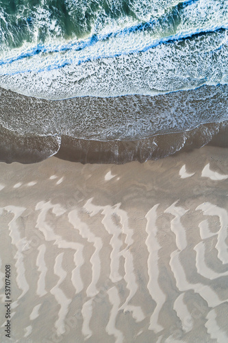 Abstract aerial top view of sand lines created by the wind and waves at the North Sea beach near Slufter valley, Texel, Noord-Holland, Netherlands. photo