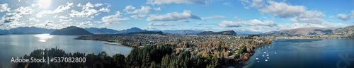 Panoramic over Kelowna city with the seascape view, sky, and mountains background photo