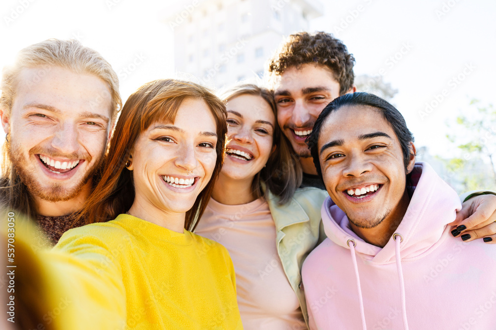 Group multiracial friends taking selfie picture with mobile smartphone-Smiling guys, focus on face 