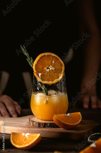 Freshly squeezed orange juice on dark background
