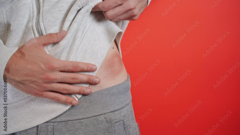 Bloody circular wound from an abdominal injury. Wound healing and