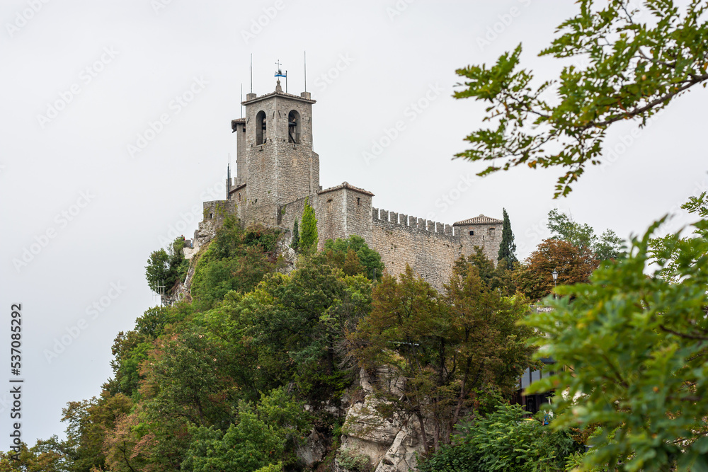 View of the Chesta Tower on Monte Titano in San Marino capital. Tower on a cliff over 800 meters high in an independent country San-Marino in the heart of Italy, Europe. High quality photo
