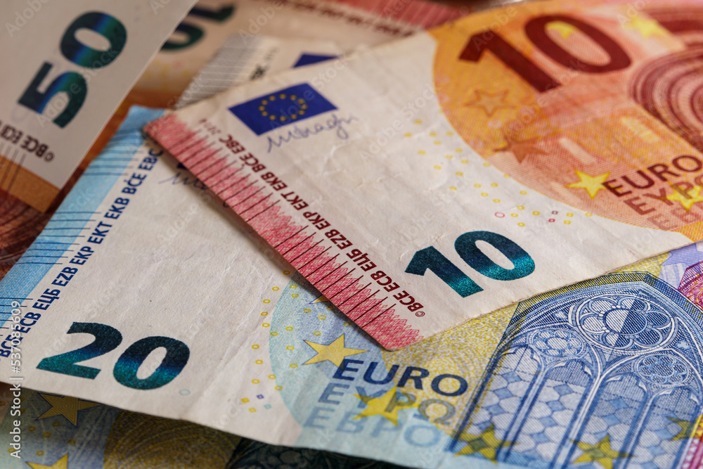 Euro banknotes on the table. Money background. 10, 20 and 50 euro banknotes close-up, soft focus Euro banknotes on the table. Money background. 10, 20 and 50 euro banknotes close-up, soft focus