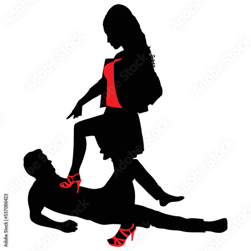 man lying on the floor while a woman steps on his chest