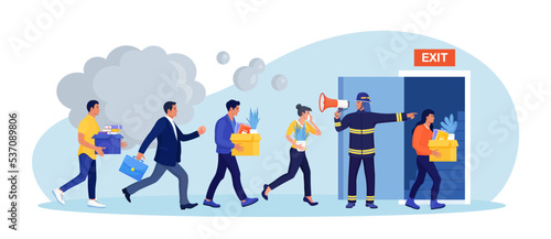 Employees leaving office, workplace in life-threatening situation. Building evacuation procedure. Fireman with megaphone announces fire emergency evacuation alarm. Firefighter with loudspeaker