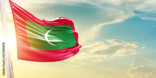 Maldives national flag cloth fabric waving on the sky - Image photo