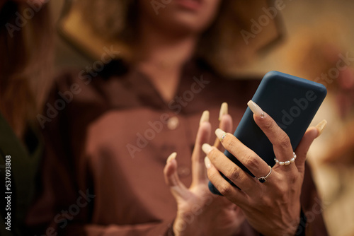 Woman texting message on smartphone