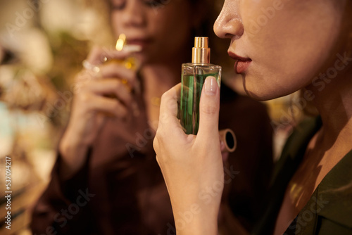 Obraz na płótnie Woman choosing new fragrance for herself