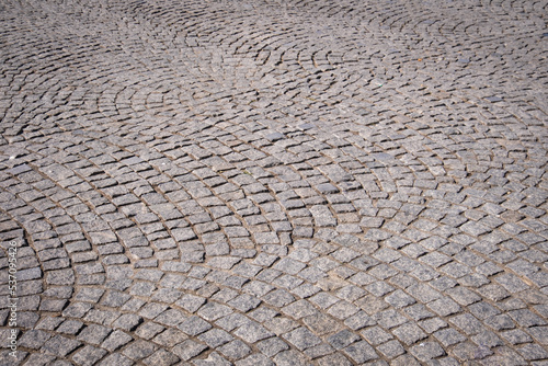 cobblestone road. natural stone paved street floor.