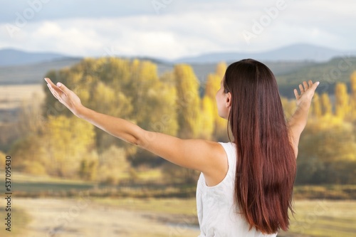 Woman open arms at nature feel free