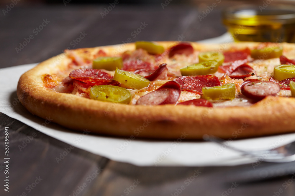 tasty pizza on the wooden background tasty pizza on the wooden background