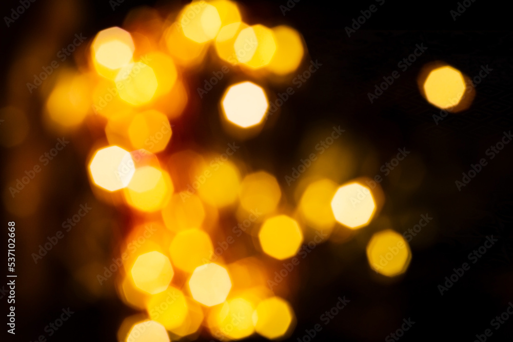 Defocused abstract background of warm lights of a Christmas garland