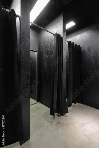 Obraz na plátně Black fitting room in the clothes shop