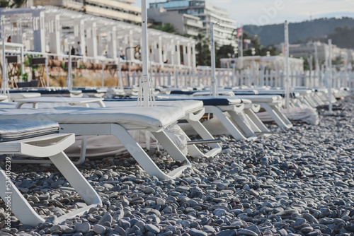 Nice, France - 29.09.2022 : Mornong sun loungers on the beach in Nice