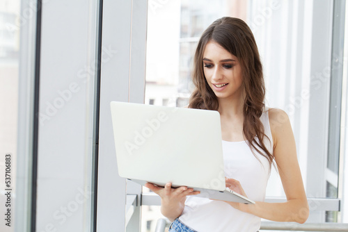 Business woman busy working on laptop computer at office.