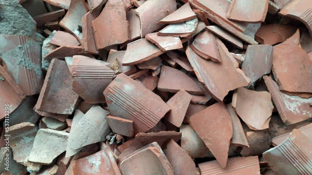 Heap of broken roof tiles made of terracotta. Heap of broken roof tiles made of terracotta.