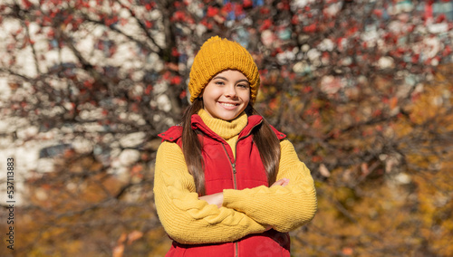 positive teen girl at school time outdoor in autumn season