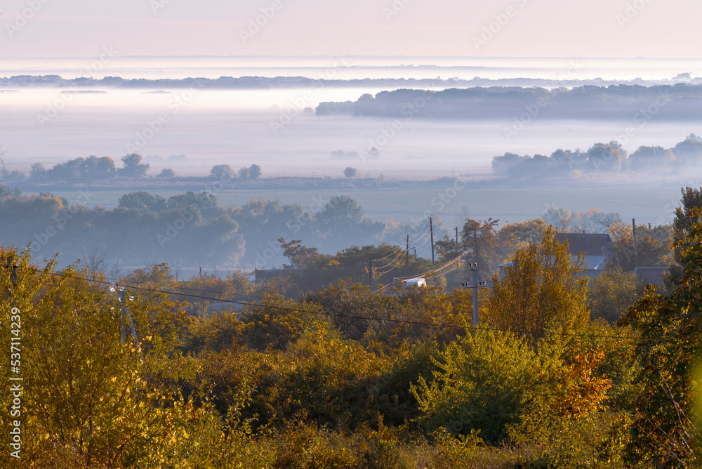 mysterious fog on hillside in  autumn Mist, trees are wet, damp fog of forest beautiful landscape Olanesti Moldova Panoramic view  rural village Early morning river dniester.