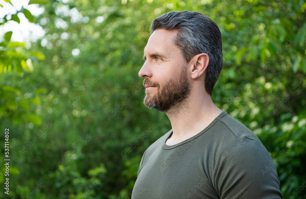 profile view of bearded man in shirt. caucasian man with beard. mature man outdoor. copy space profile view of bearded man in shirt. caucasian man with beard. mature man outdoor. copy space