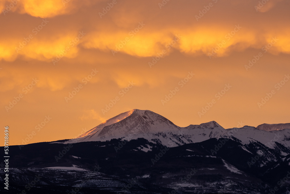 Clouds Blow Bright Yellow Over The La Sal Mountains