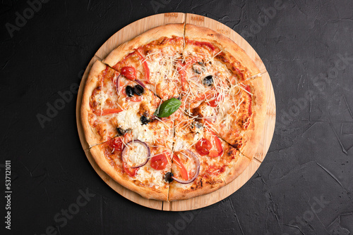 Pizza, different pizzas with different fillings on a black background