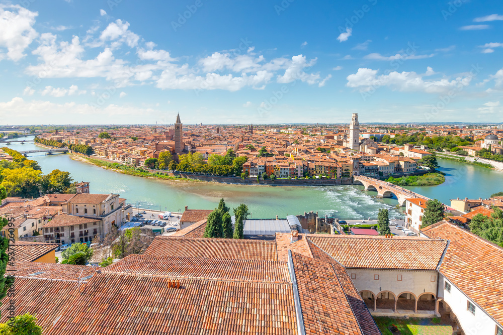 View of the historic center of the city of Verona, Italy and the Ponte Pietra bridge and river Adige from the hillside fortress of Castel San Pietro.