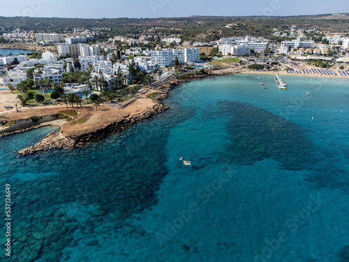 Aerial panoramic view on holidays resorts and blue crystal clear water on Mediterranean sea near Fig Tree beach, Protaras, Cyprus © barmalini