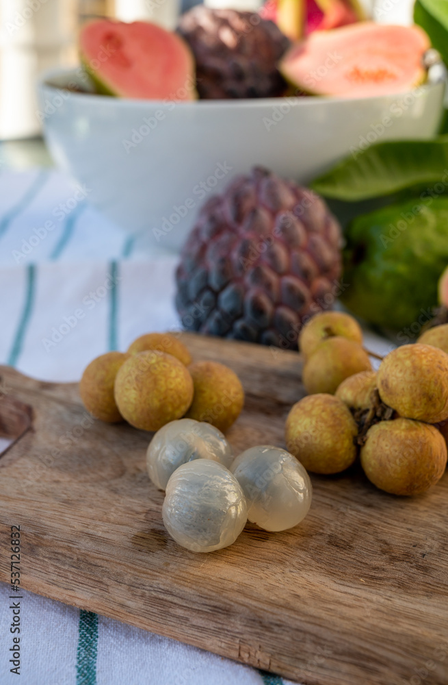 Tasty tropical exotic fruits, ripe fresh peeled lychee fruits