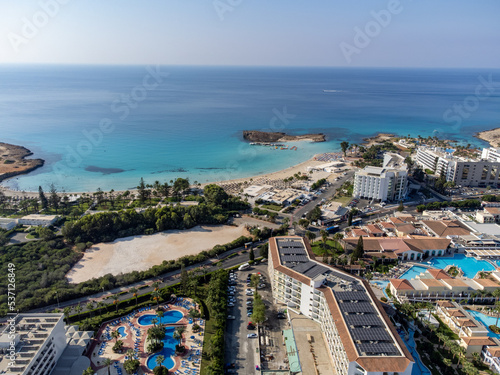 Fototapeta Naklejka Na Ścianę i Meble -  Aerial panoramic view on blue crystal clear water on Mediterranean sea near Nissi beach, Ayia Napa, Cyprus