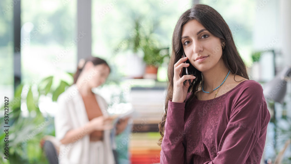 Professional young woman having a phone call Professional young woman having a phone call