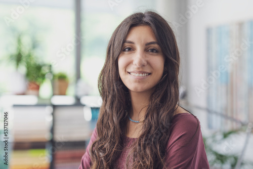 Happy young woman posing indoors Free Download Happy young woman posing indoors - GFXLoad