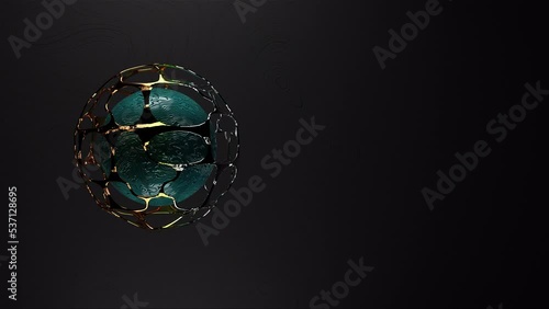 Abstract Spinning Gold Cell and Emerald Sphera Loop Background photo
