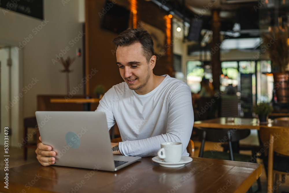 one man work on laptop computer at cafe with bad news worried one man work on laptop computer at cafe with bad news worried