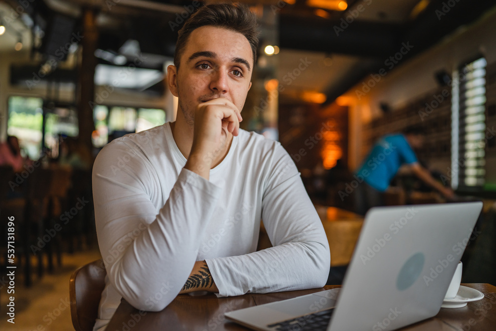 one man work on laptop computer at cafe with bad news worried one man work on laptop computer at cafe with bad news worried