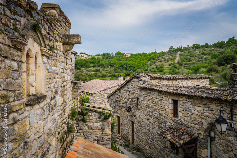 View on the beautiful stone facades and medieval houses of the small historical village of Rochecolombe in the South of France (Ardeche)