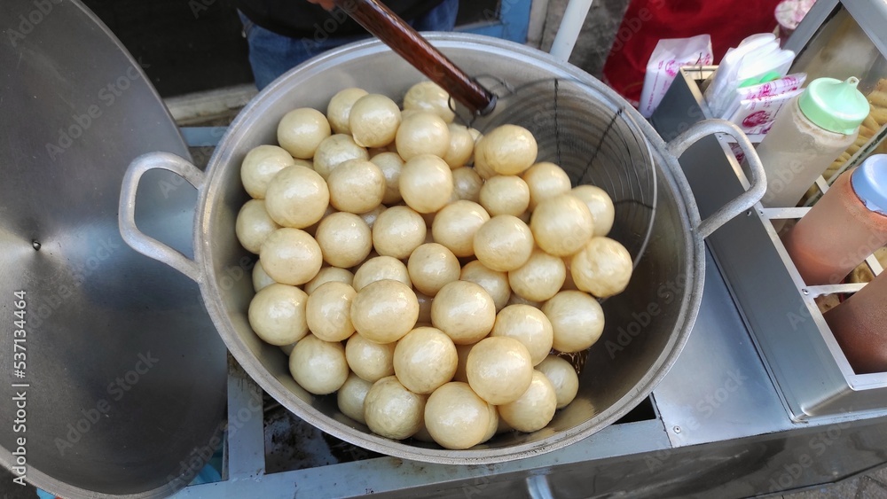 Street food of the deep fry process of rounded tofu sell in the food