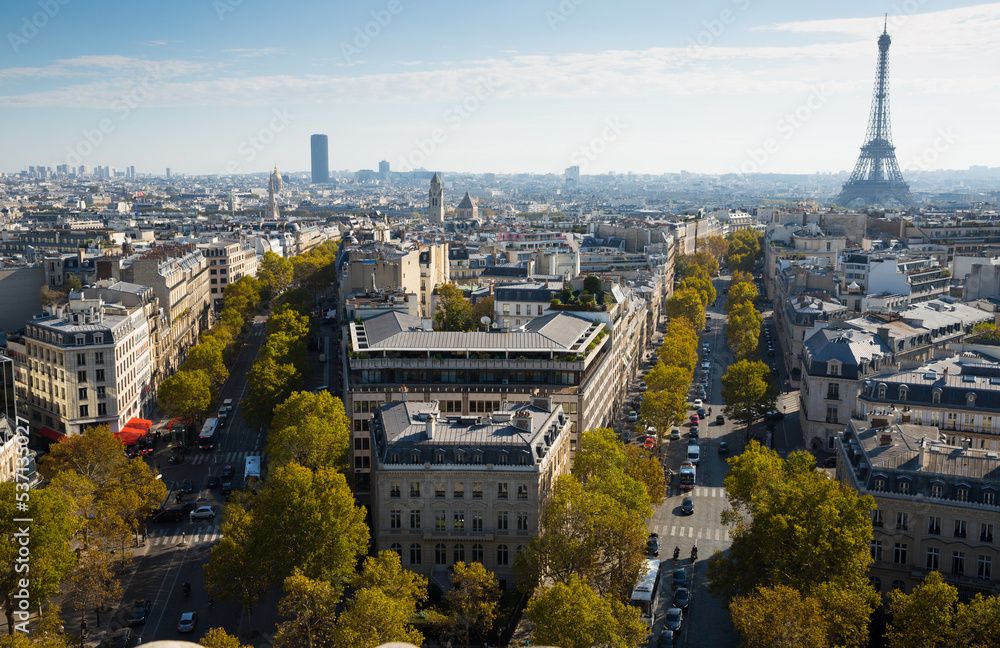 Picturesque panoramic view of Paris with Eiffel Tower from roof of Triumphal Arch, France