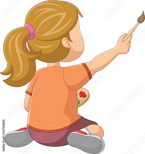 Cute girl sits on the floor and draws on the wall