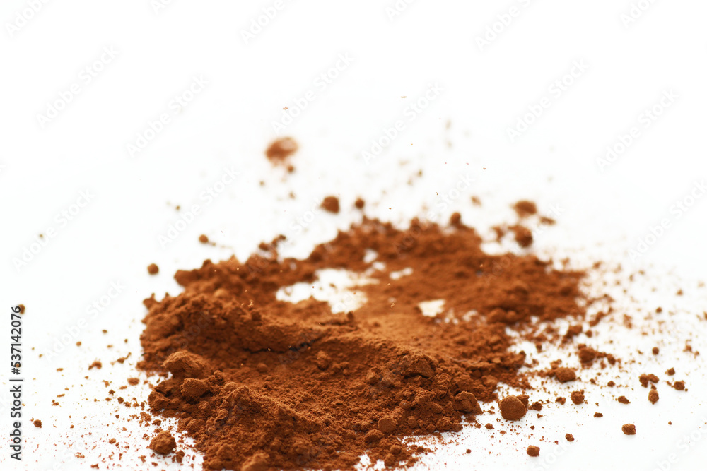 Close up of cocoa powder on white background Close up of cocoa powder on white background